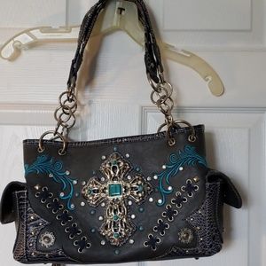 Purse with concealed weapon pocket